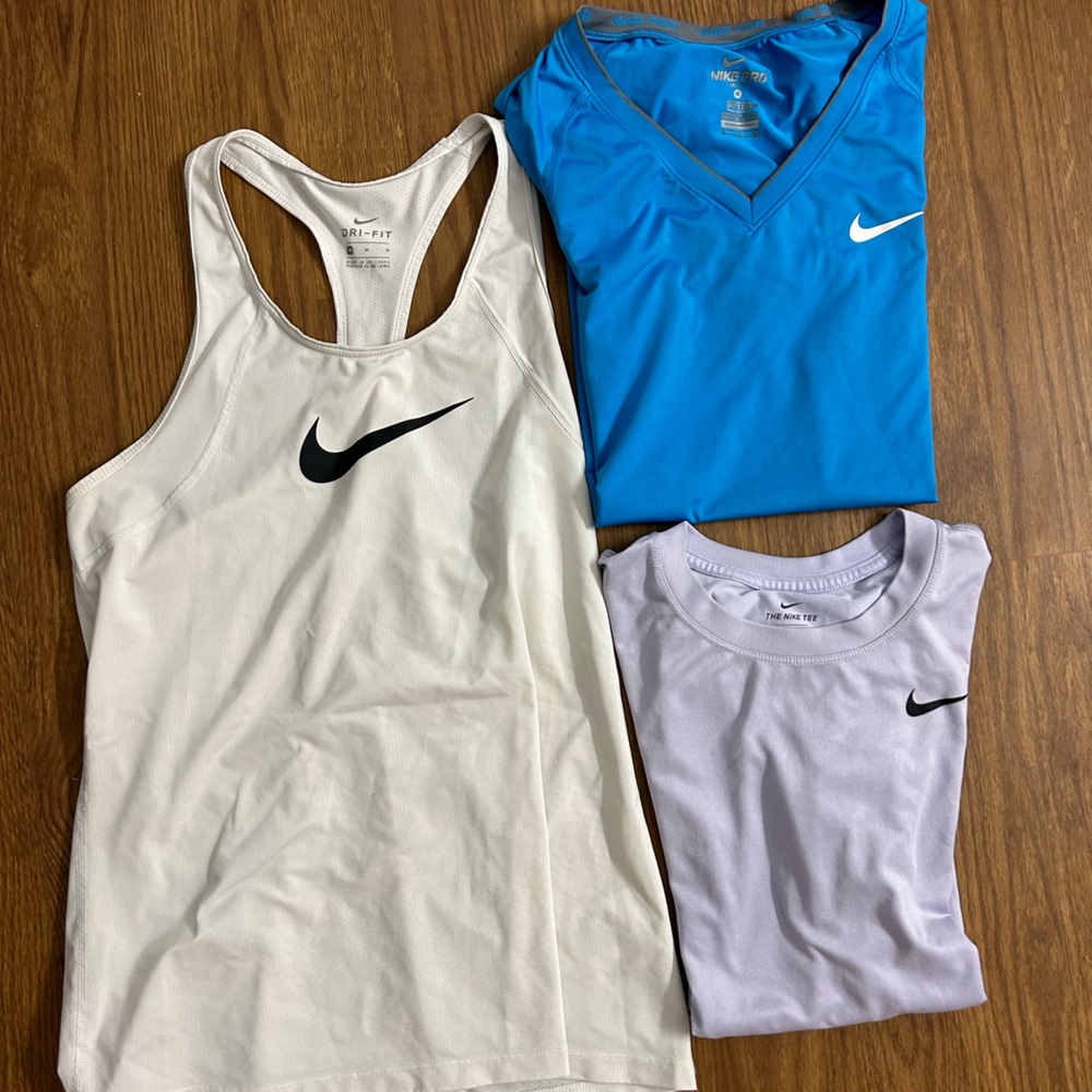 Three Nike tops